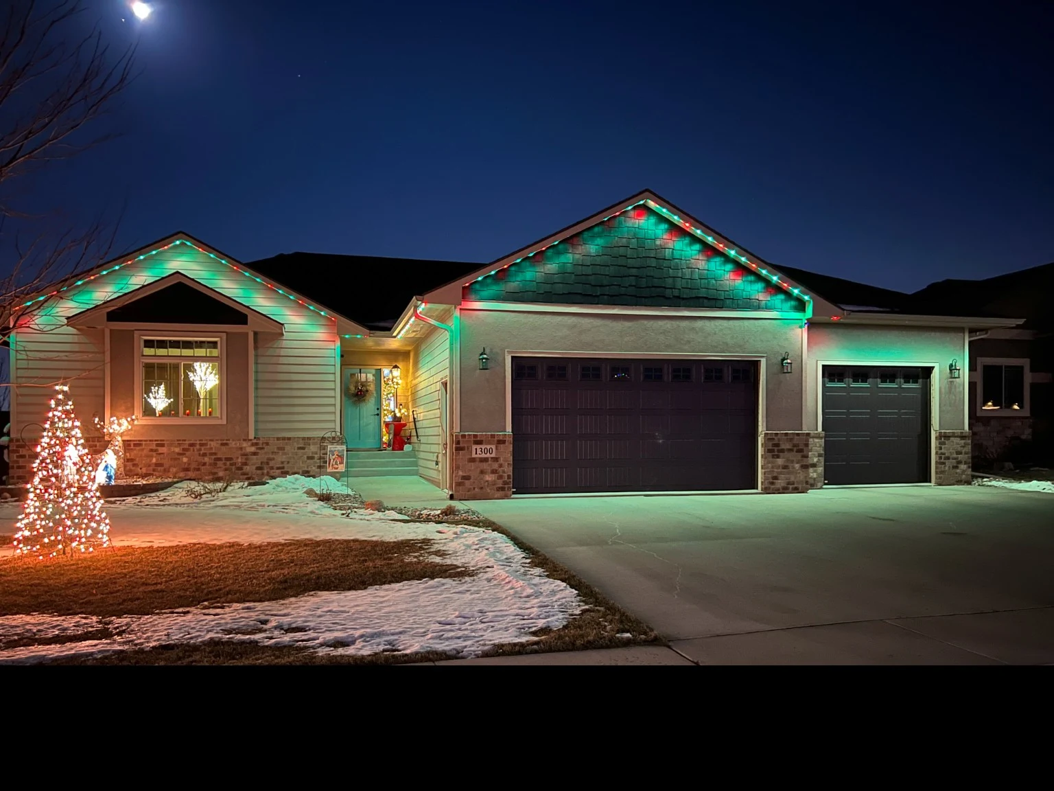 Red and green roofline lighting in winter