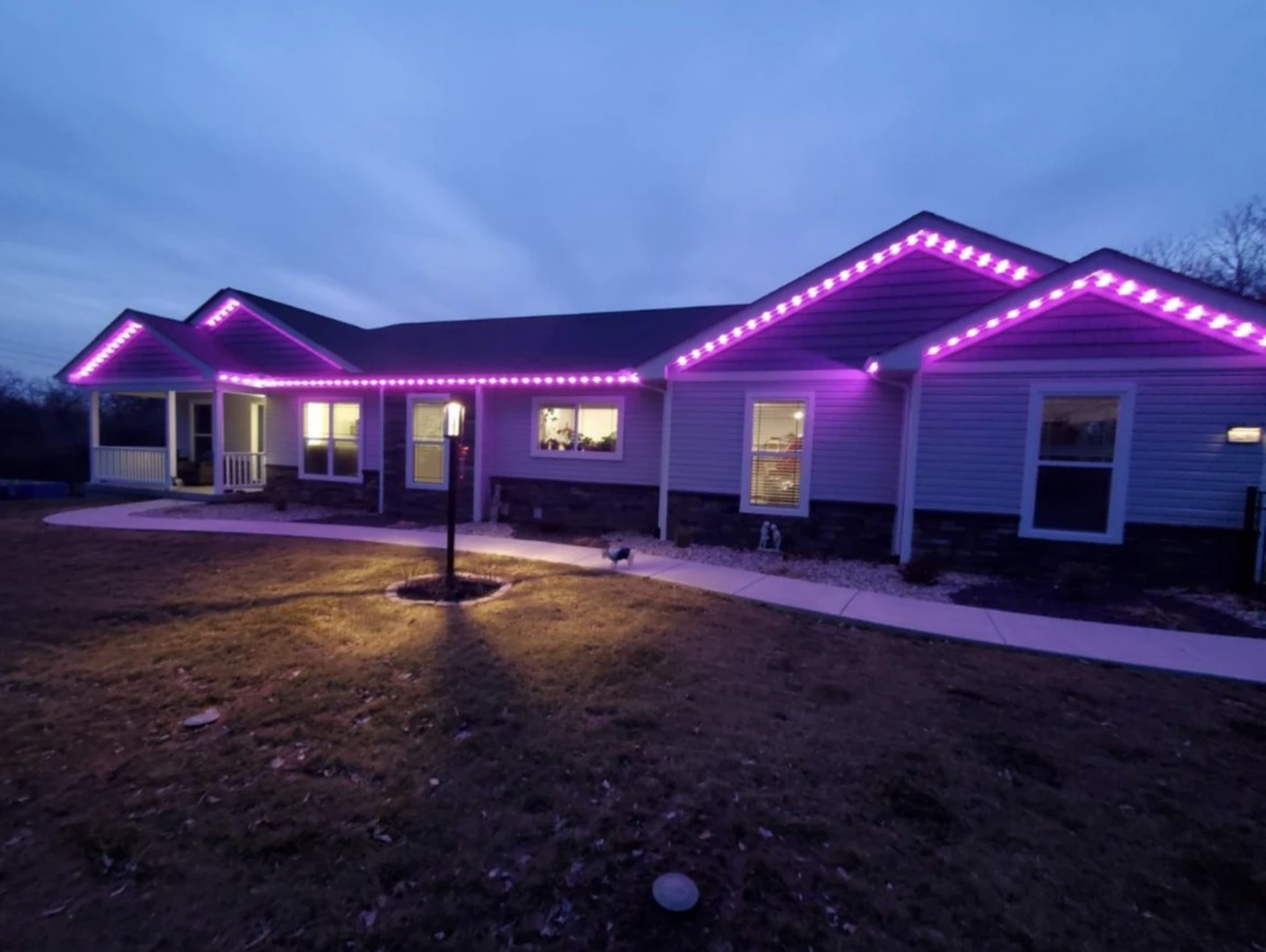 Purple roofline lighting at dusk